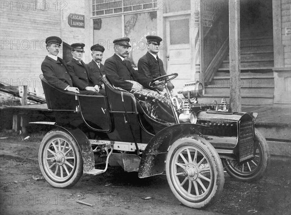 Men In An Early Auto