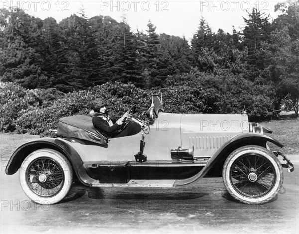 Woman Driving A Stutz Roadster