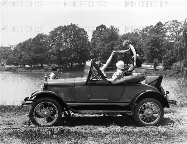 A Woman Exiting A Rumble Seat