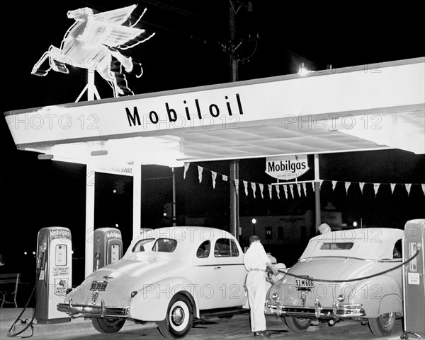 Cars At A Mobil Gas Station