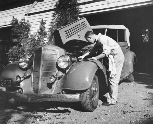 Man Working On HIs Car