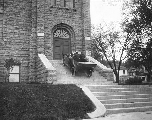 Car Climbs Church Steps