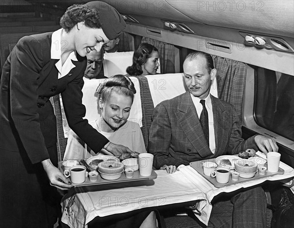 A Stewardess Serving Breakfast
