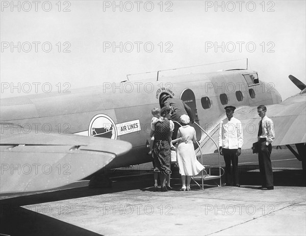 Passengers Boarding Airplane