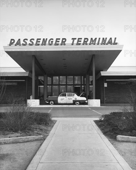 Denver, Colorado:  c. 1954
A taxi cab at the entrance to the passenger terminal at Stapleton International Airport.   © Underwood Archives / The Image Works