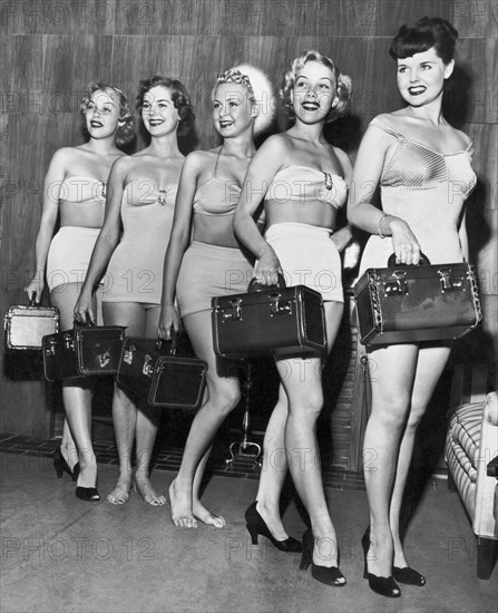 Five Women Pose With Bags