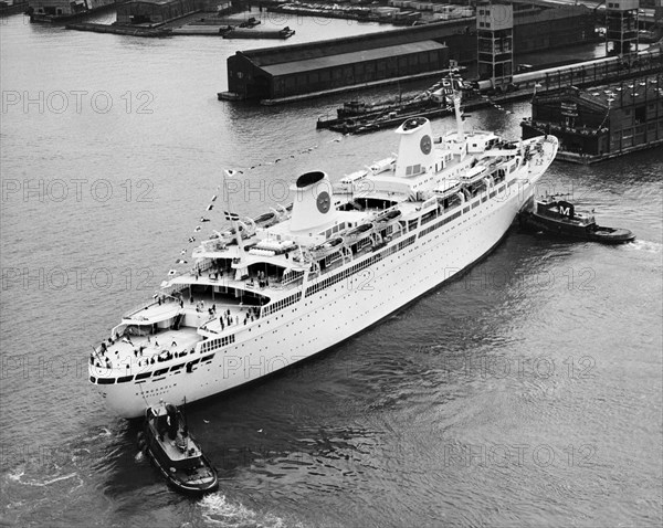 Tugs Pushing Ocean Liner