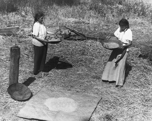 Indian Women Winnowing Wheat