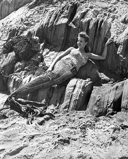 Lounging Mermaid On The Rocks