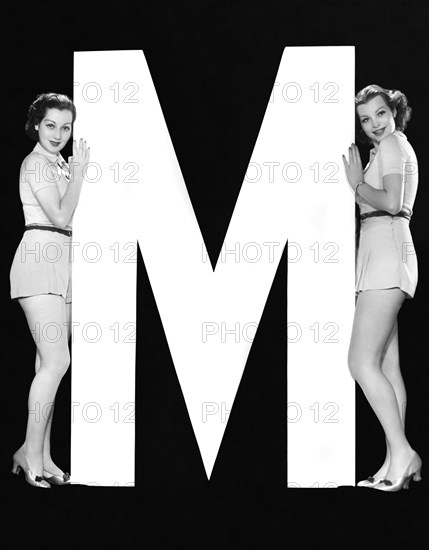 The Letter "M"  And Two Women