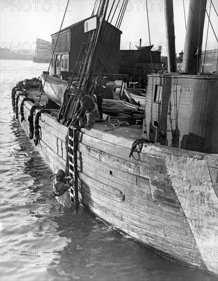 A Deep Sea Diver On A Boat