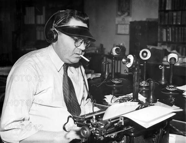 Newspaper Man At His Desk