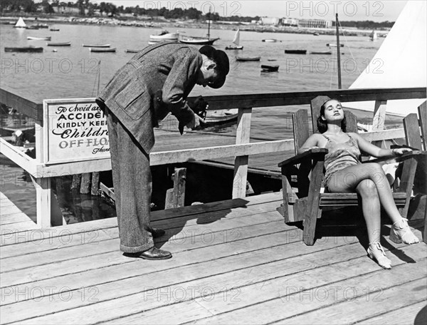 Man Photographs Sleeping Girl