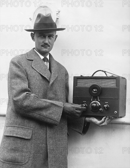 Man And HIs Tiny Radio