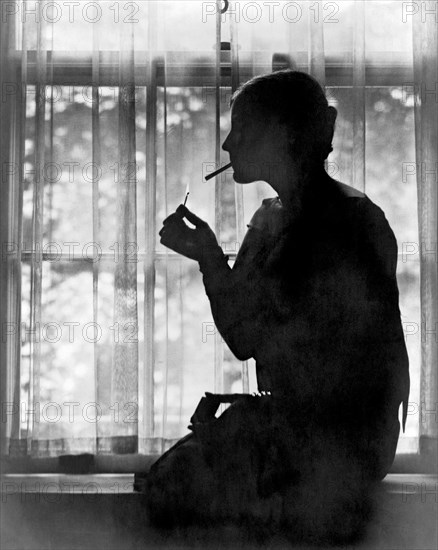 Silhouette Of A Woman Smoker
