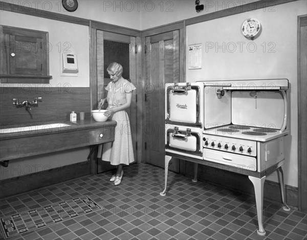 A Woman Cooking In Her Kitchen