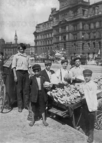 Indianapolis, Indiana:   August, 1908.
Italian boys earning a living on the street as banana vendors.