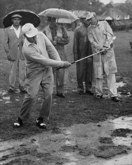 Golfer Playing In The Rain