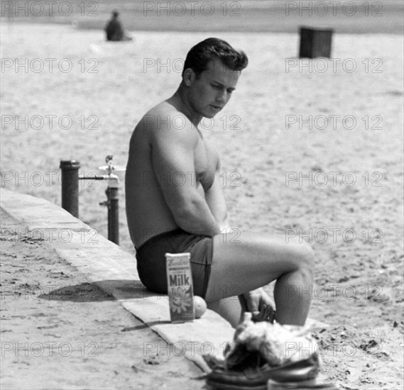 Body Builder At The Beach.