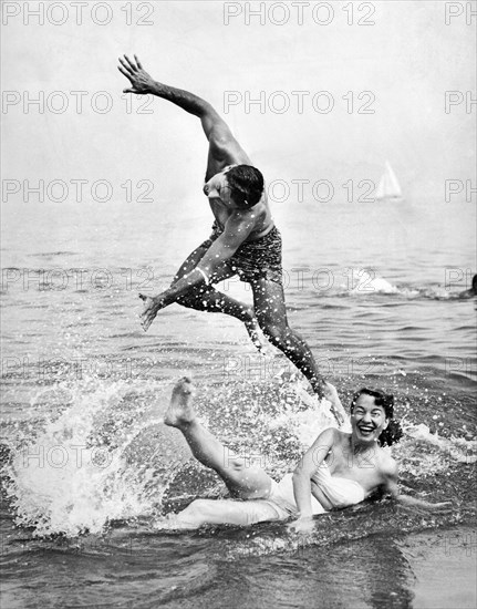 Couple Frolics In The Surf