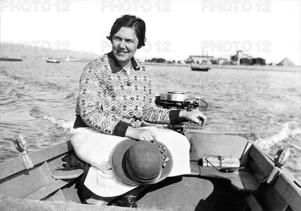 A Solo Woman In A Motor Boat