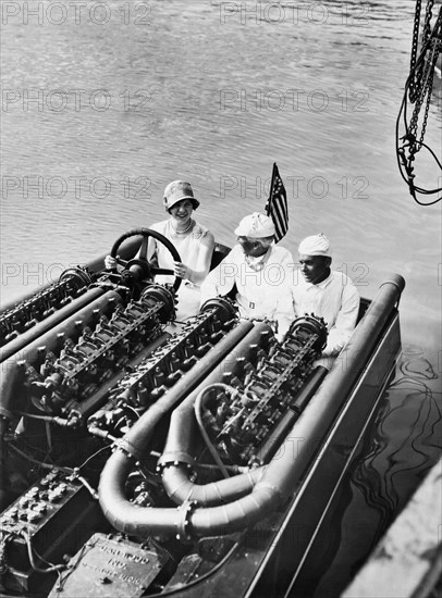 Commodore Gar Wood in his speedboat, Miss America V