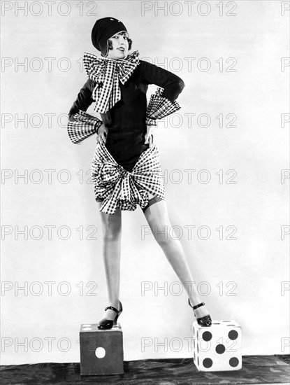 A Woman Standing On Dice