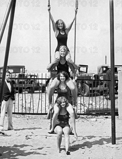 Four Girls On A Swing Set