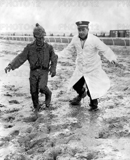 Jockey Rescued From The Mud