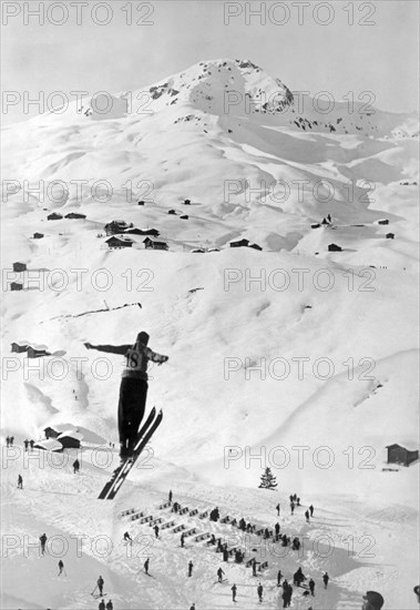 Skier Leaping Over A Valley