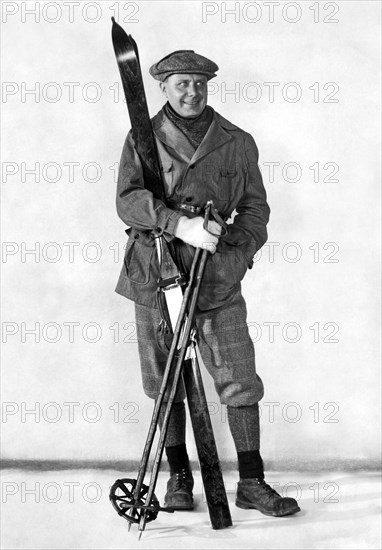 A Man Poses With Skis