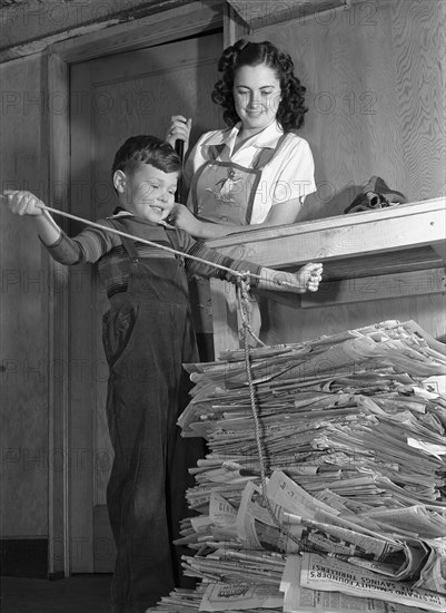 A Boy Recycling Newspaper