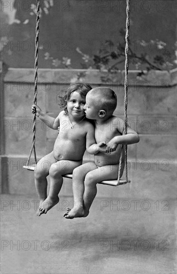 Young French Lovers On A Swing