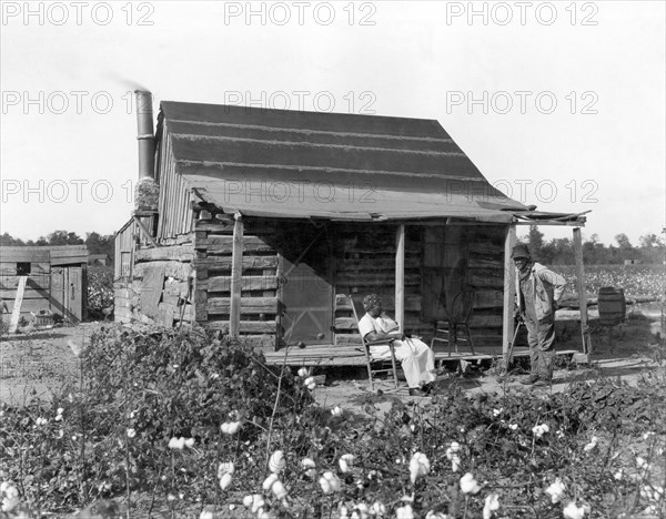 Former Slaves At Their Cabin