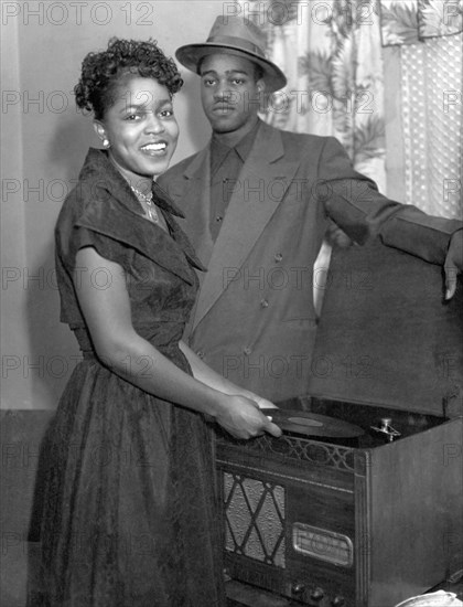 Stylish Couple Playing Records