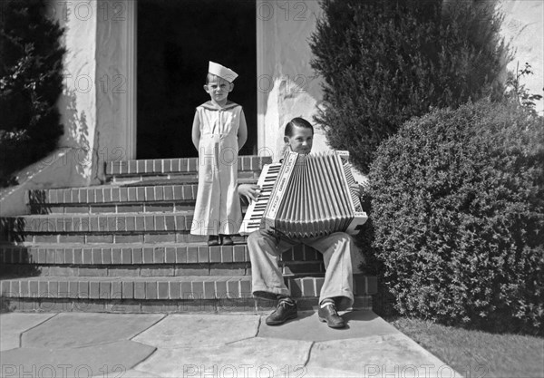 Boy Playing Accordian On Steps