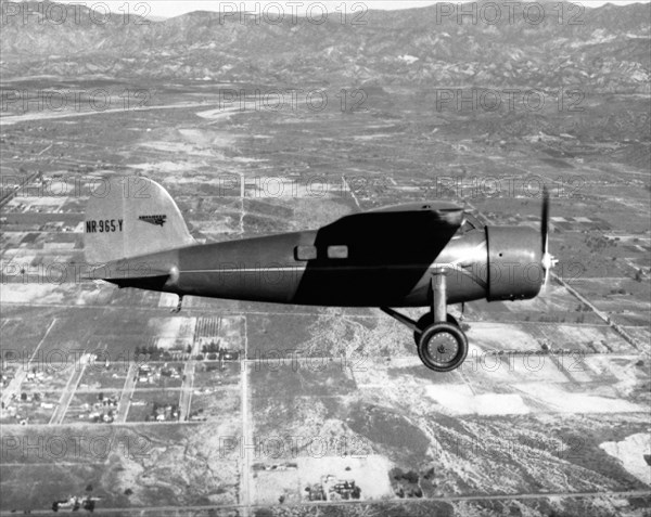 Amelia Earhart in her plane