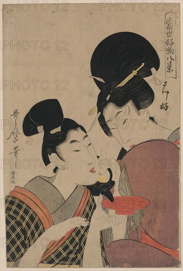 Two Women, one pouring Tea