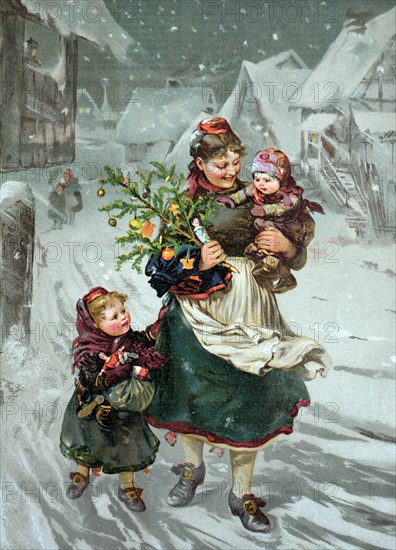 Woman, children and christmas tree