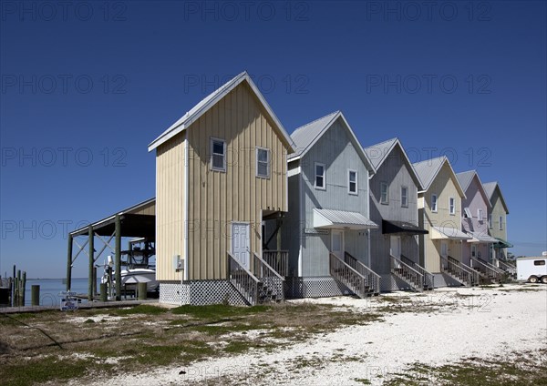 Fishing houses line the beach on Dauphin Island, Alabama 2010