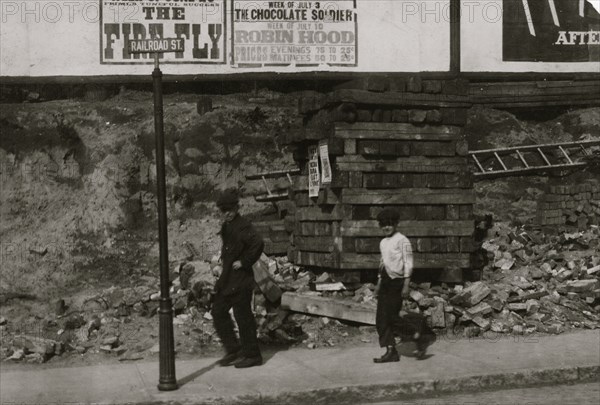 15 year old driver of oil wagon and his 10 year old helper.  1916