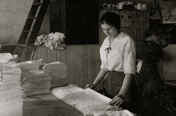 Folding towels in Bonanno Laundry. 1917