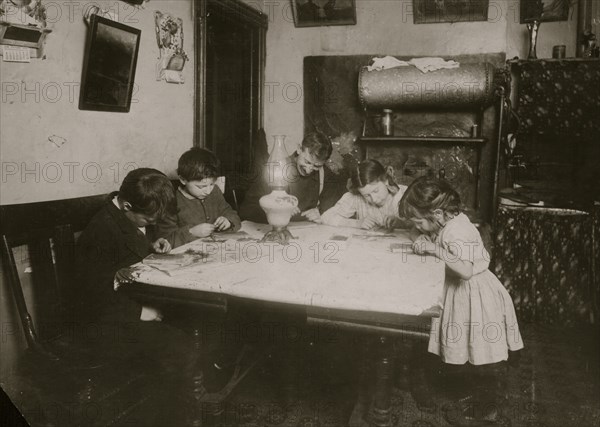 They had temporarily discontinued the brush making, but sent to a neighbor for materials and posed for me, just as they had been doing it. The little five year old on the right is very deft. . 1912