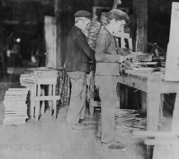 A Basket Factory. Boys making grate bottoms. 1908