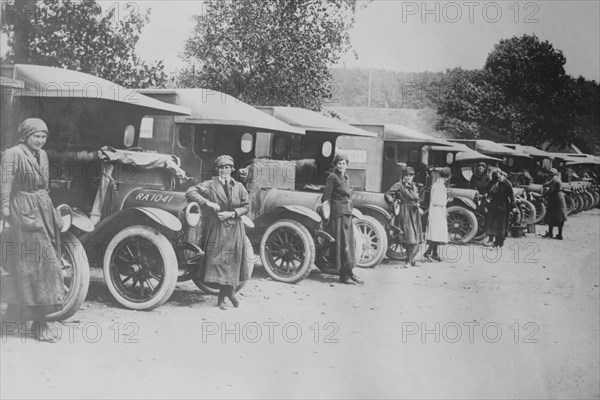 A line of Women Ambulance Drivers with their vehicles 1917