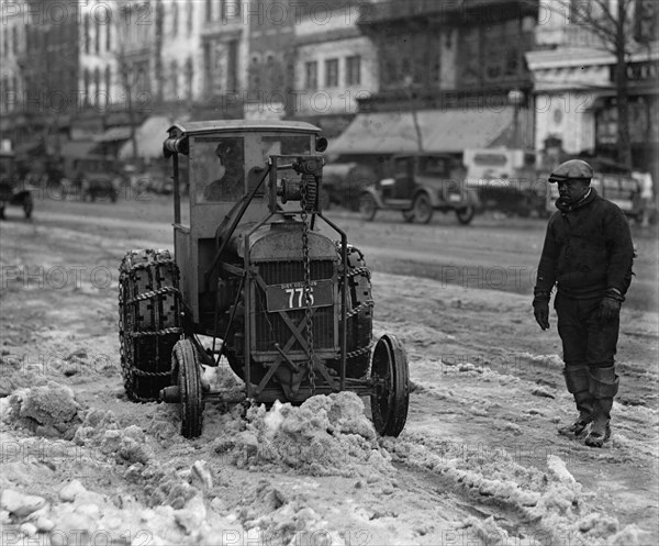 A Ford Tractor cleans snow on DC Street 1924