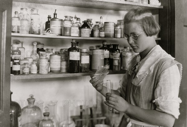 A Third year high school girl in the chemical laboratory, - Greenbank Consolidated School, 1921