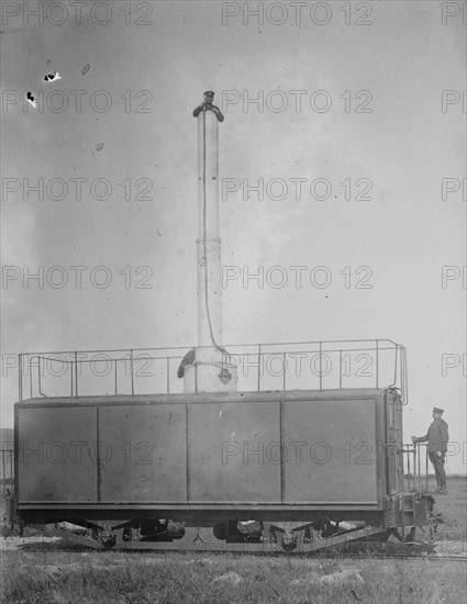 Train Carries a man 10 stories aloft on what looks like a Chimney