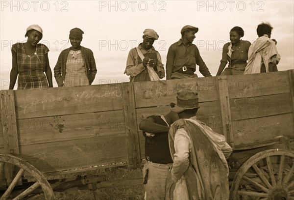 African American Cotton pickers at end of day's work, Pulaski County, Arkansas 1935