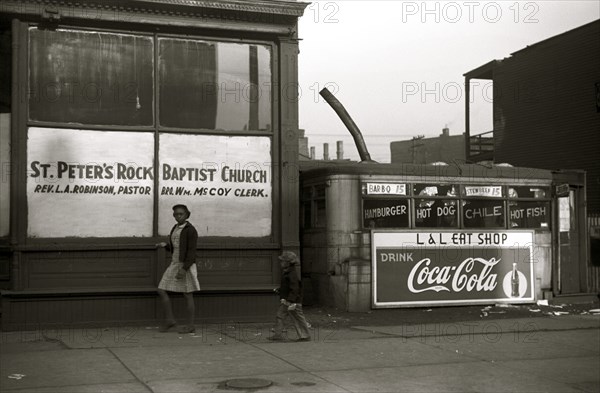African American outside Storefront church and lunch wagon, Black Belt, Chicago, Illinois 1941